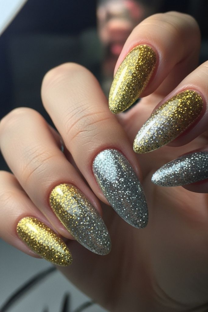 Sparkling gold and silver glitter dip powder nails on hands