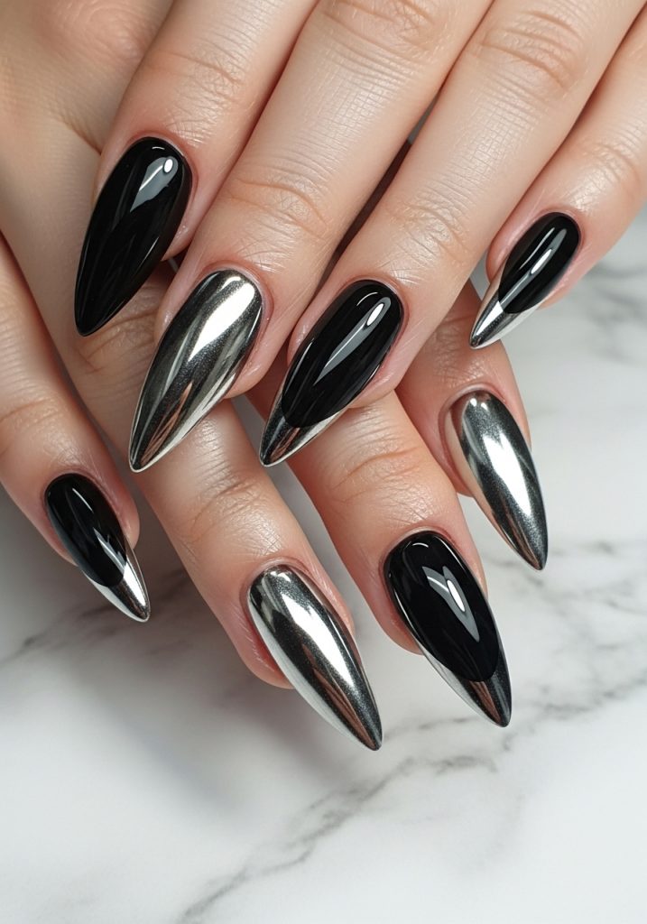 Long stiletto prom nails with jet black base and dramatic silver chrome French tips