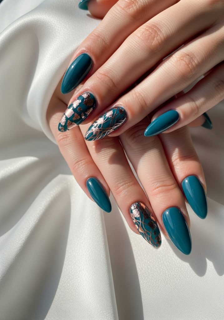  Medium stiletto shaped dark teal prom nails with delicate rose gold foil accent nail art