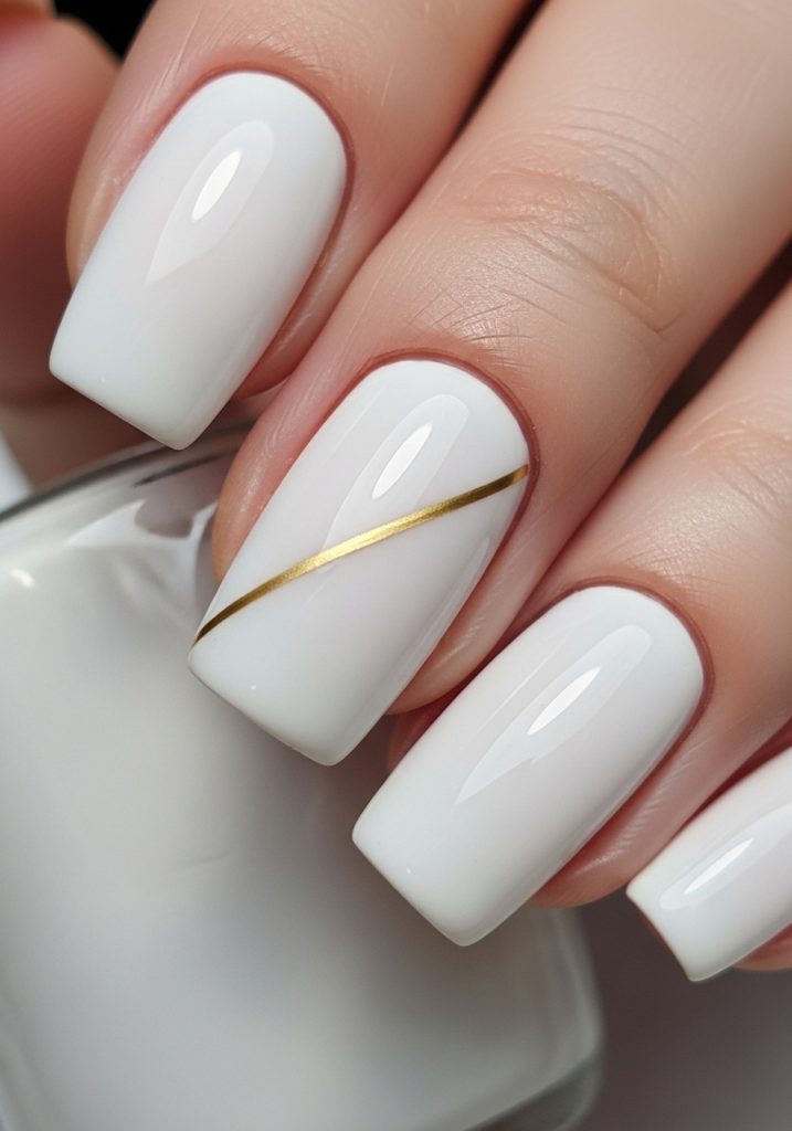 Milky white nails with a thin gold diagonal line on the ring finger, glossy finish