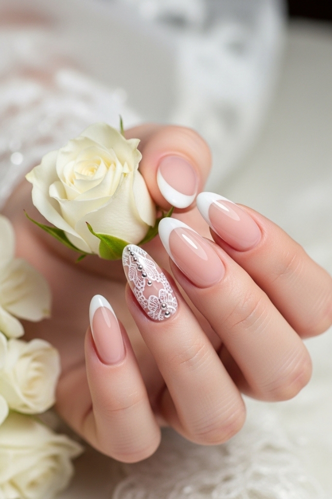 Classic French tip acrylic nails with nude base for weddings