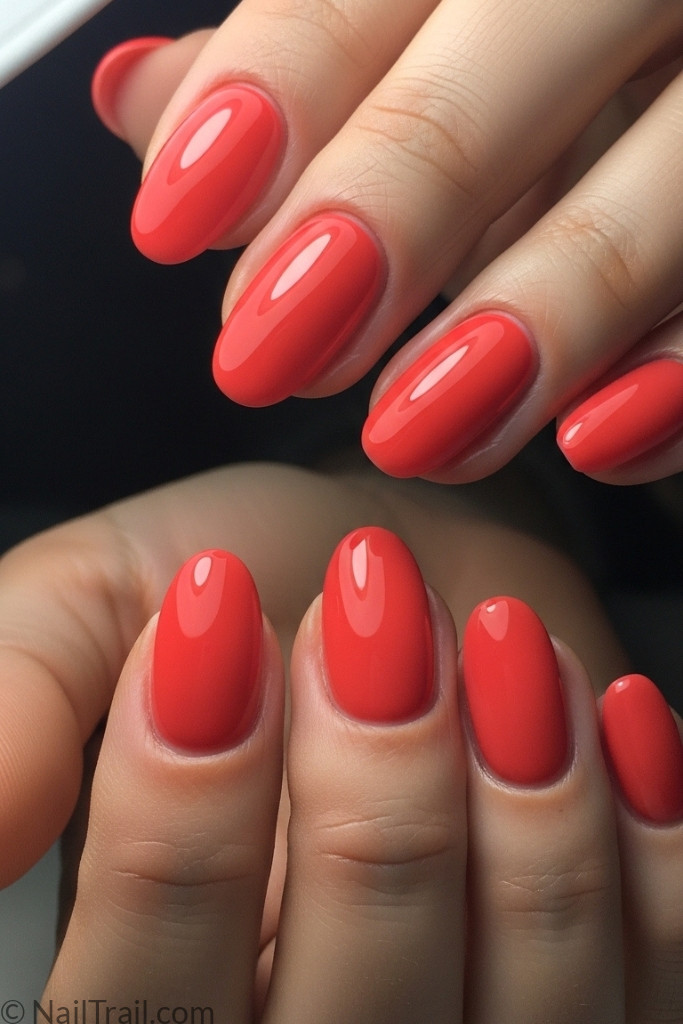 Glossy coral gel nails with smooth finish