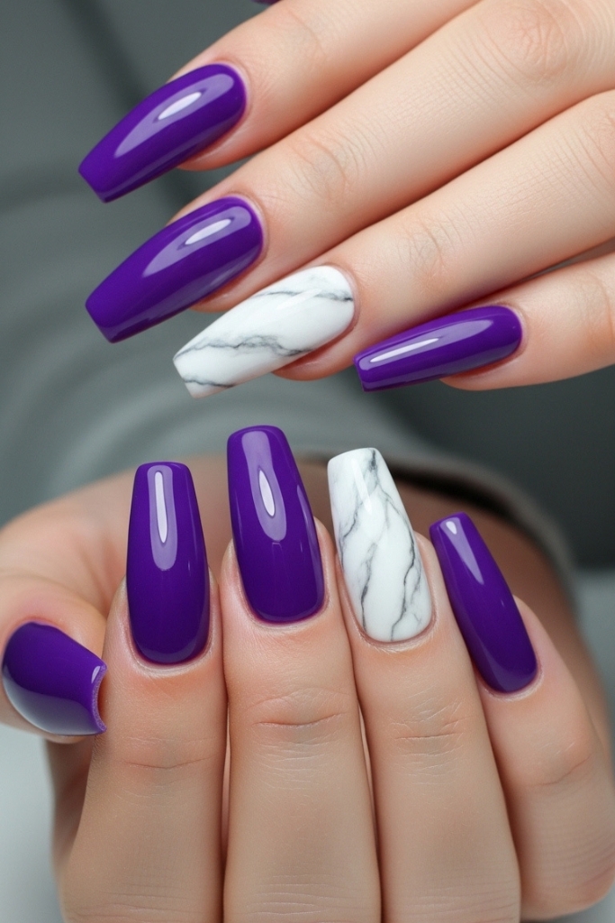 Long purple acrylic nails with white marble accents