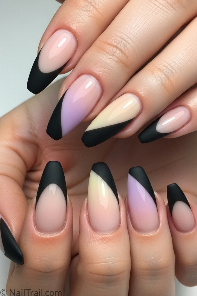 Modern black French tip nails with diagonal tips and nude gradient base