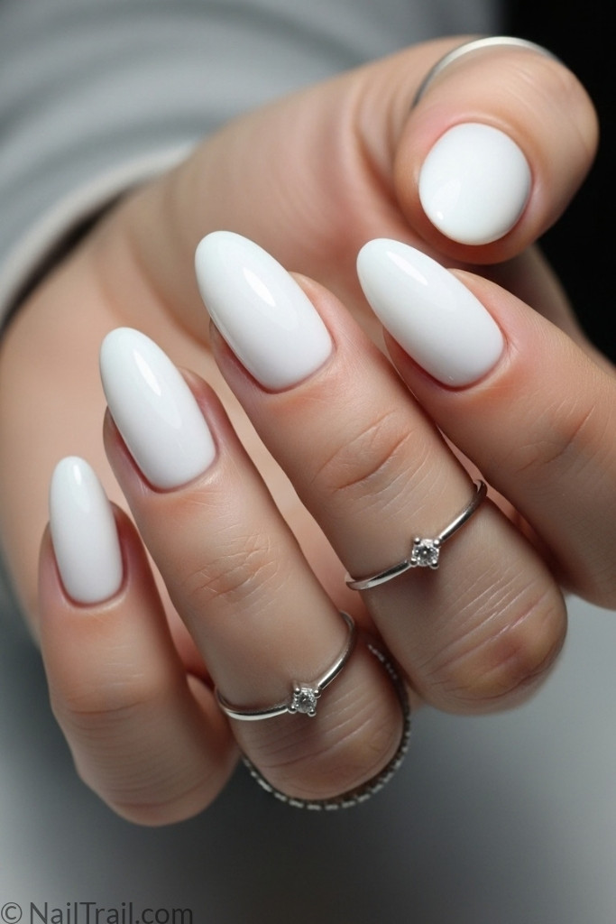 Slim oval nail shape with white polish
