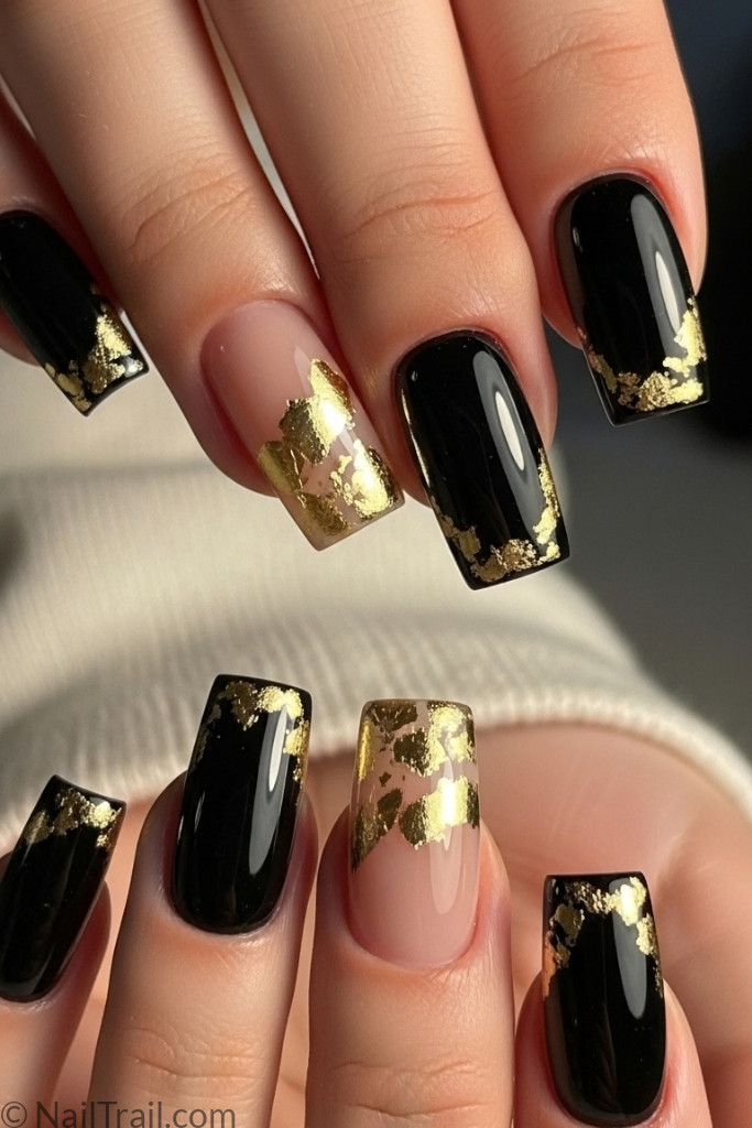 Square black French tip nails with thin gold accents
