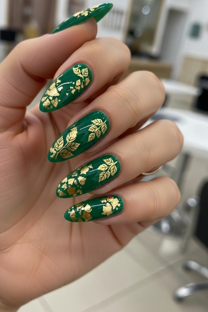Emerald green nails with gold leaf accents
