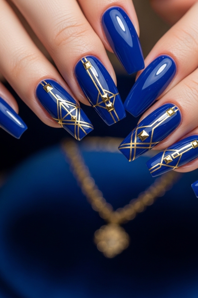 Royal blue and gold princess nail design