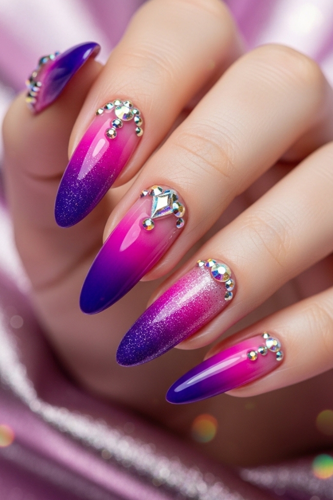 Glamorous long nails with ombre colors and crystal details, statement nail art