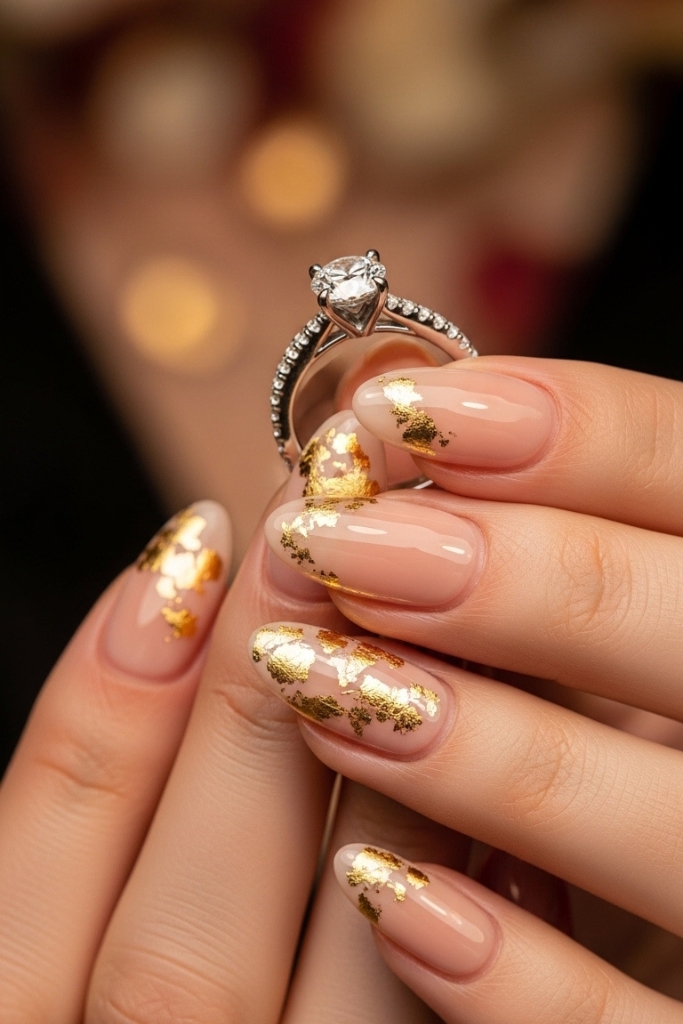 Nude engagement nails with gold foil accents