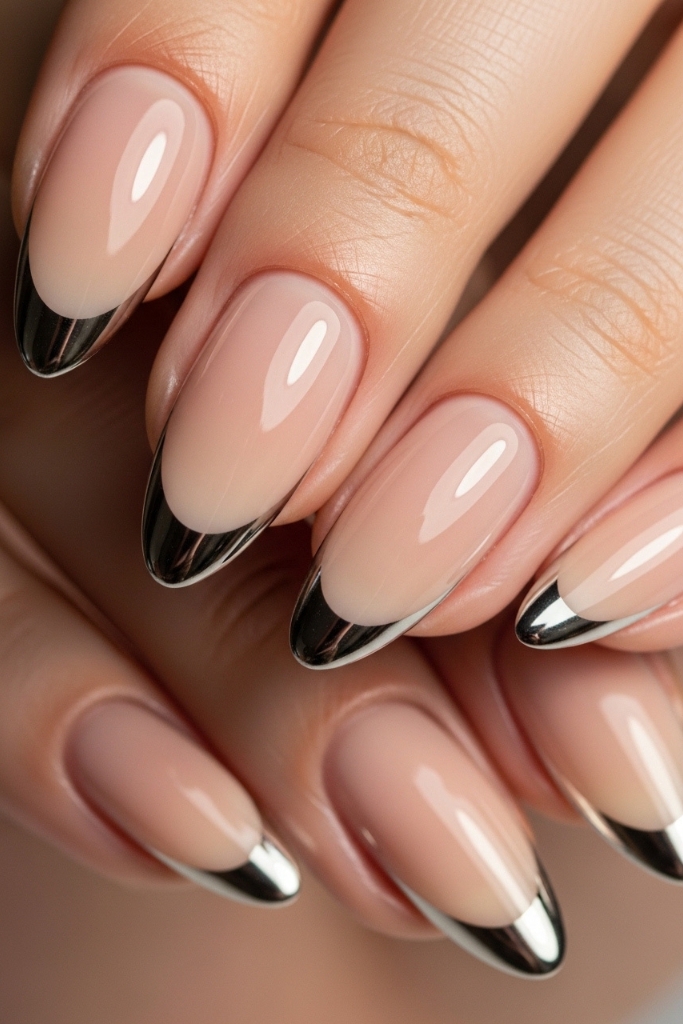 Modern chrome French tip almond nail set with nude base