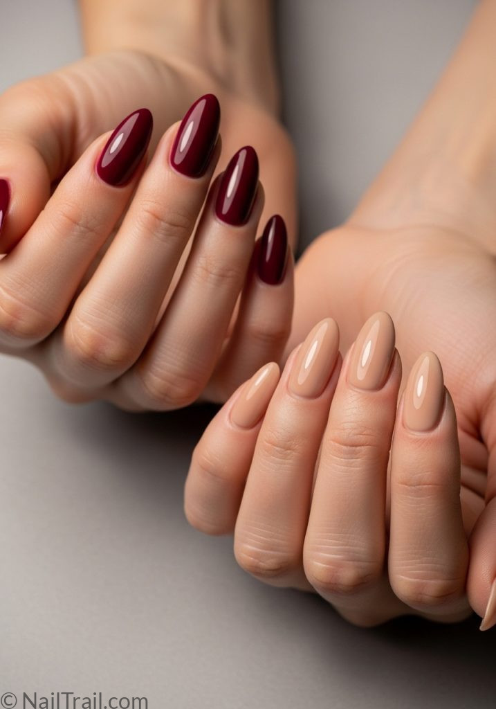 Both hands medium fair skin burgundy left nude right almond nails different colours each hand