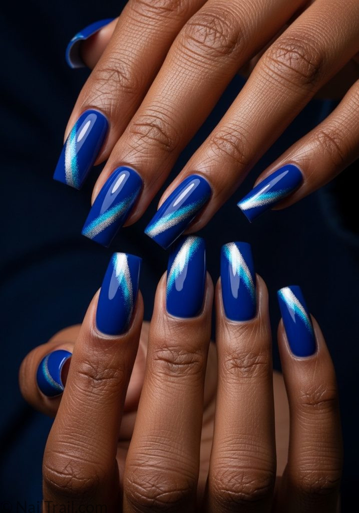 Dark skin hands with royal blue square nails cat eye shimmer royal blue cat eye nails design