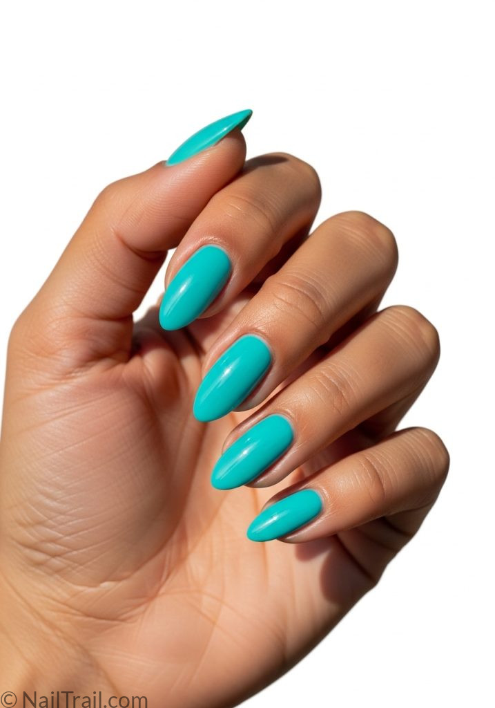 Medium tan hand with turquoise short almond nails simple tropical almond nails short simple