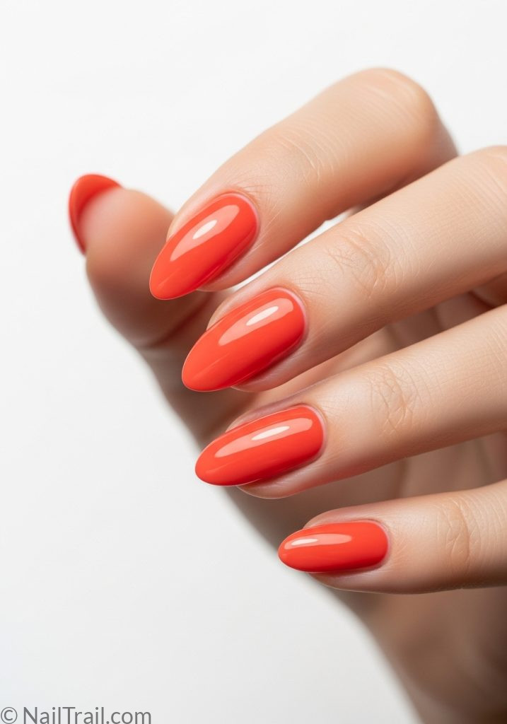 Medium fair hand with coral almond nails simple tropical almond nails simple designs