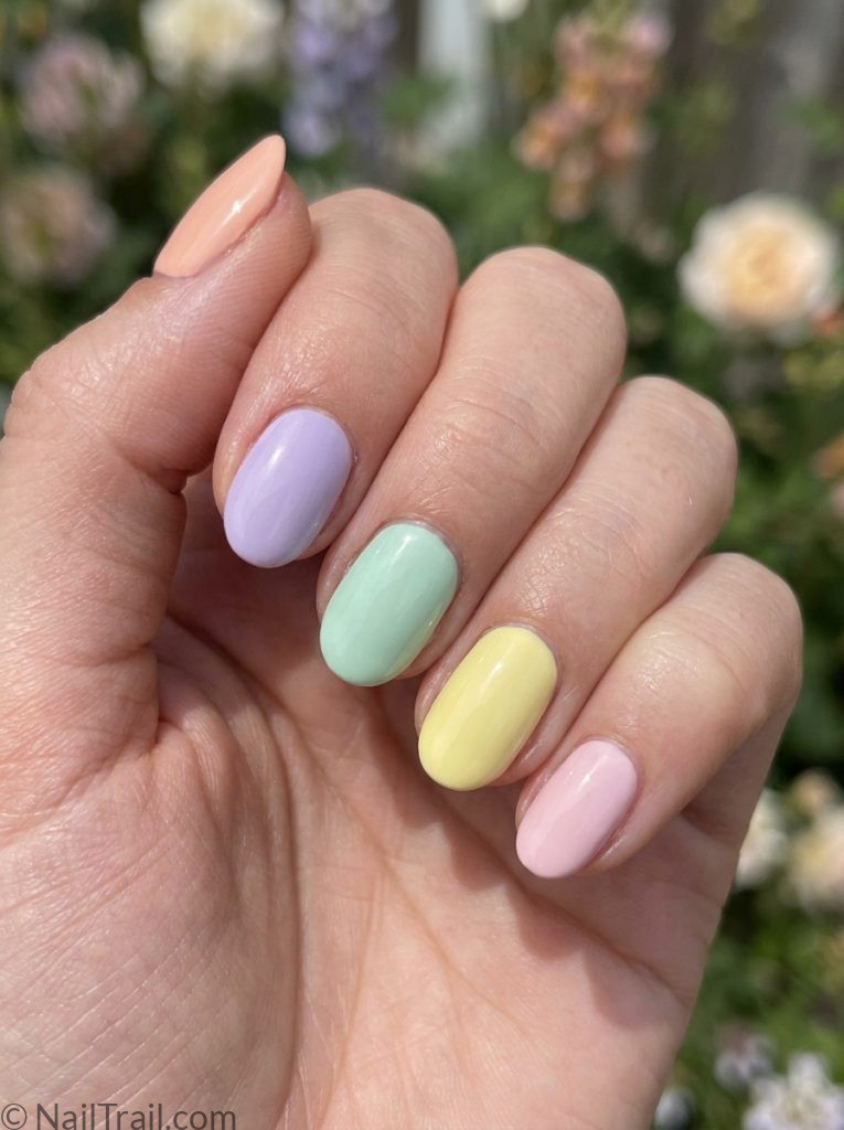 summer nails 2026 short mismatched pastel peach lavender mint yellow pink oval glossy