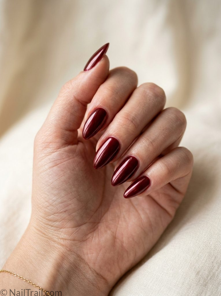 almond baddie nails deep red glazed finish high shine glossy