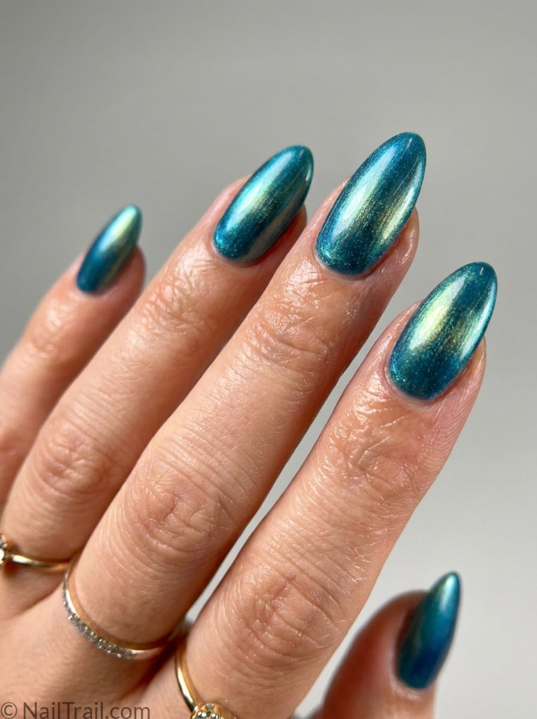 teal nails chrome aurora effect almond blue green gold shift glossy mesmerizing dimensional