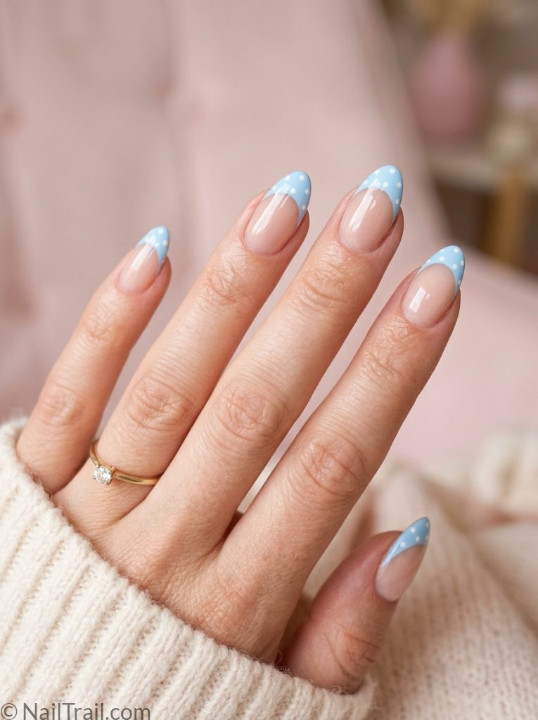 blue french tip nails polka dots almond shape white dots light blue glossy gel finish