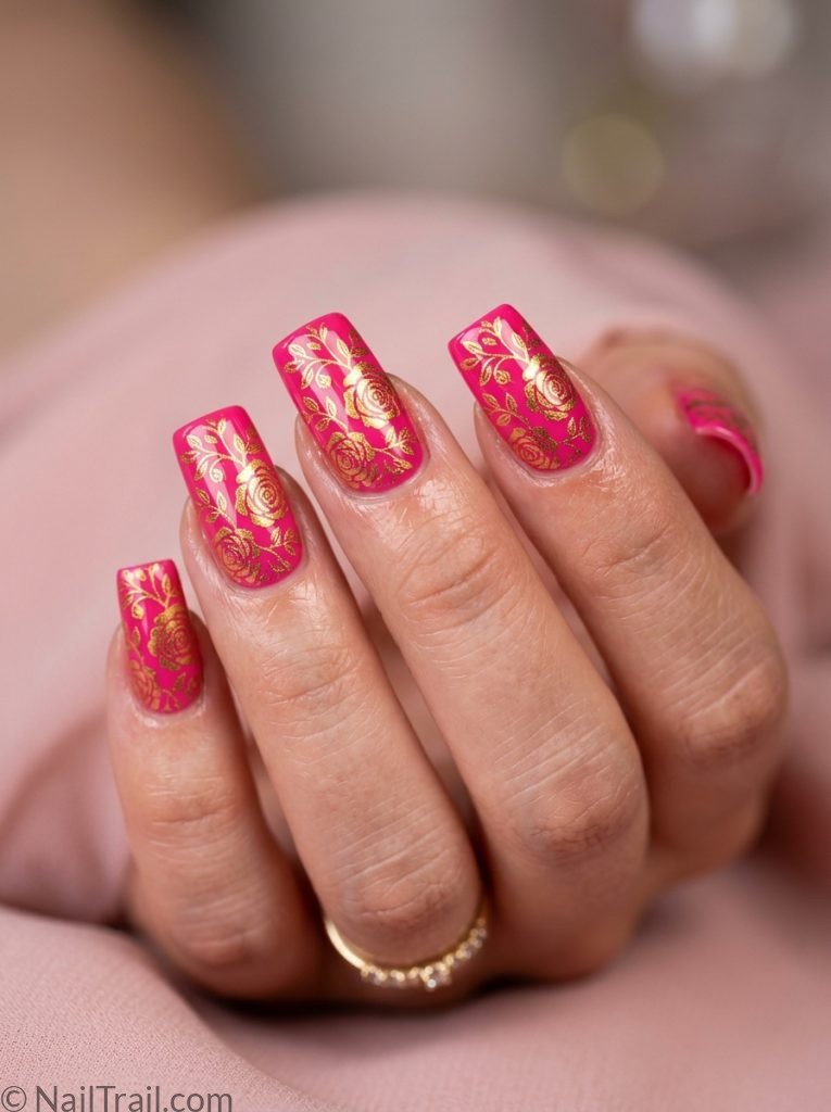 2000s square nails long square shape gold stamped floral pattern hot pink base glossy gel finish pink background