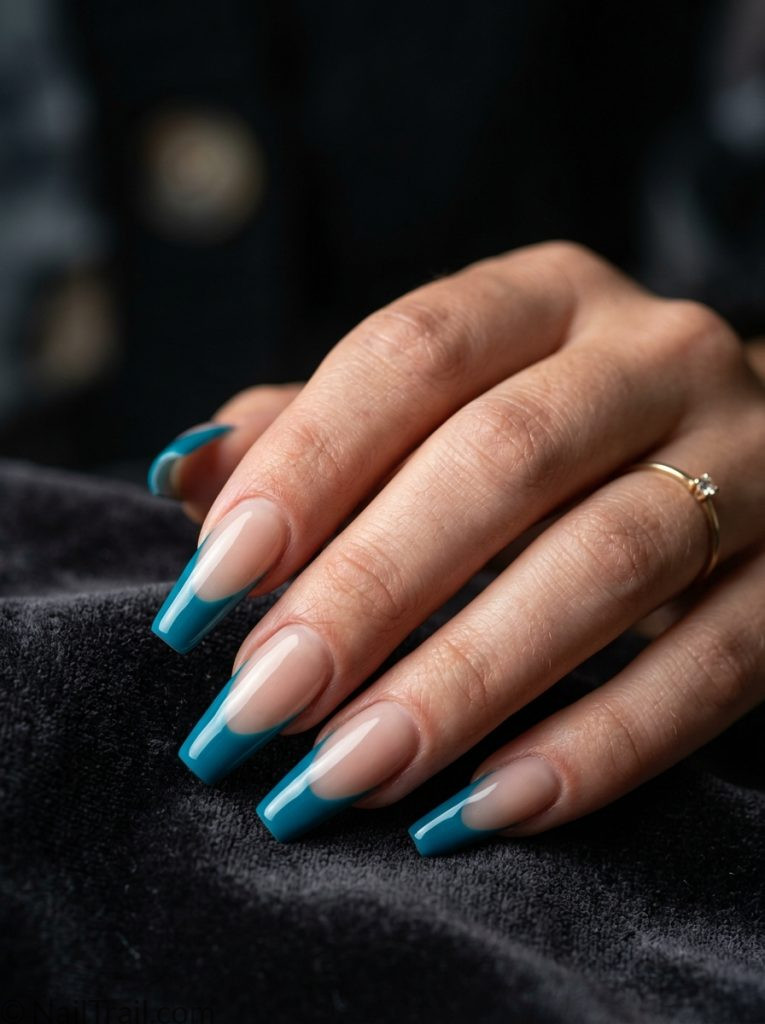 summer french tip nails teal tip coffin shape glossy gel finish dark moody background